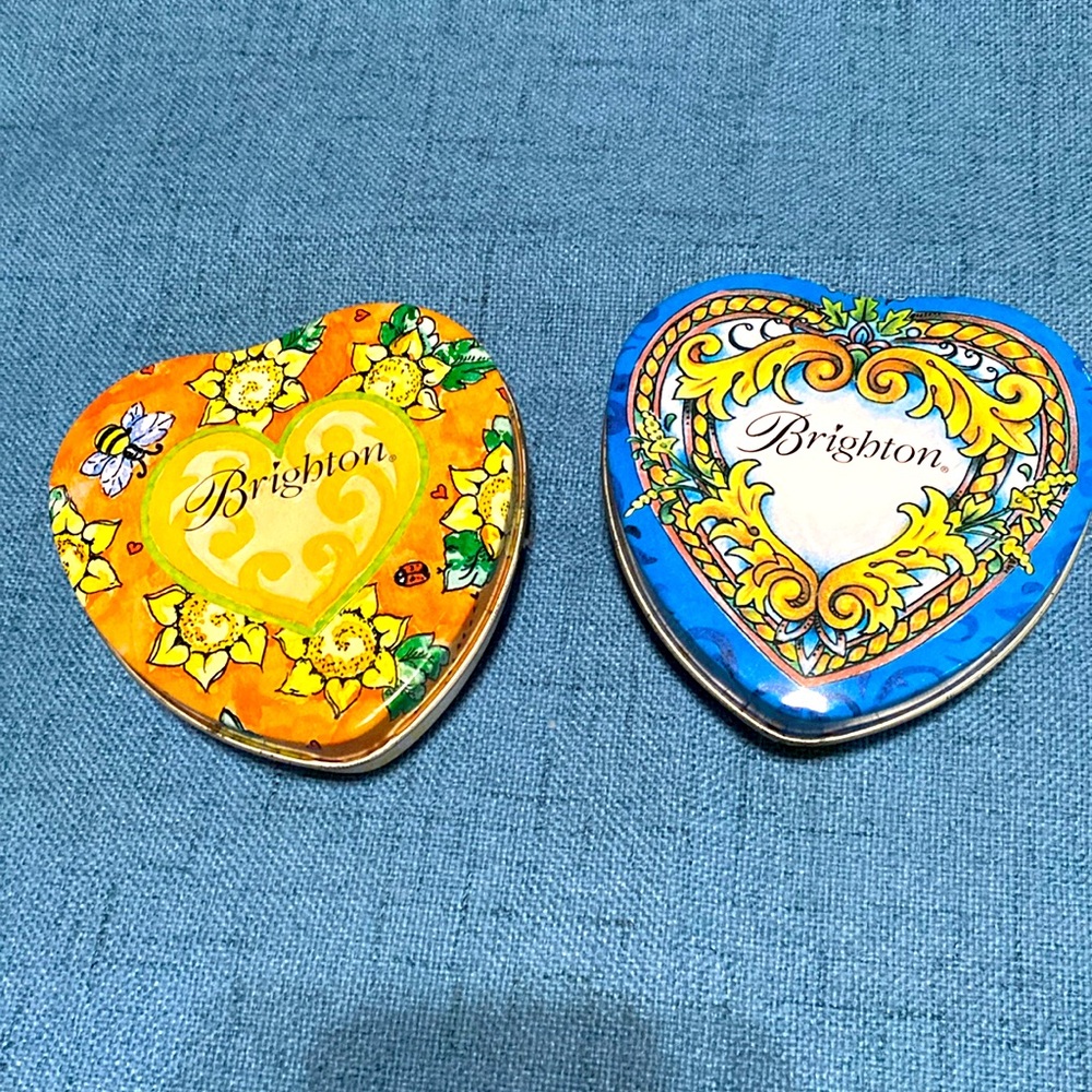Two Brighton heart tins. One blue One gold